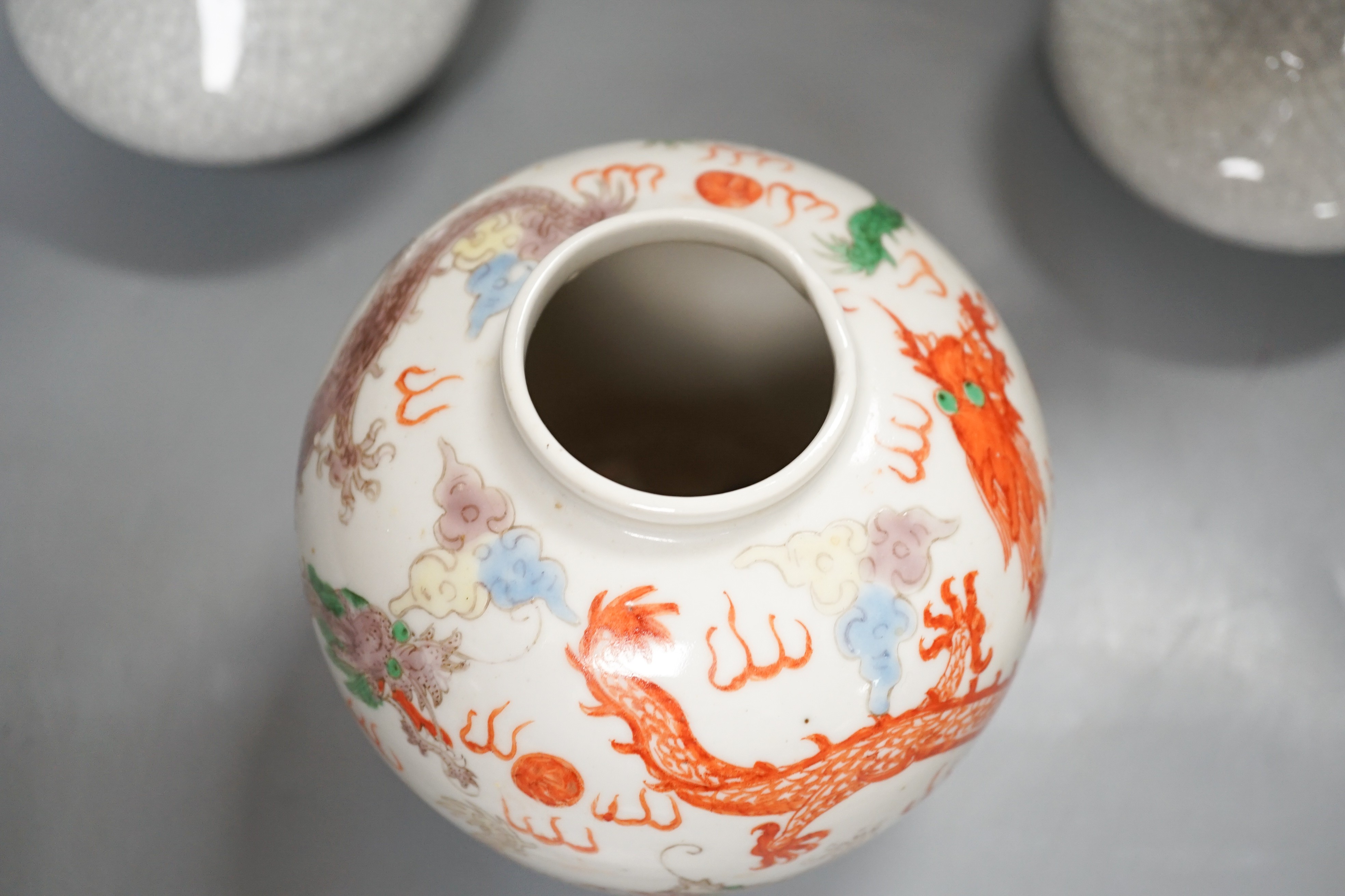 A Chinese enamelled porcelain 'dragon' jar and two crackleglaze bottle vases, tallest 19cm